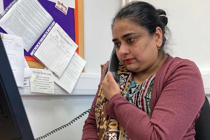 Race Equality Network Lubna Khalid working on the Womenzone helpline