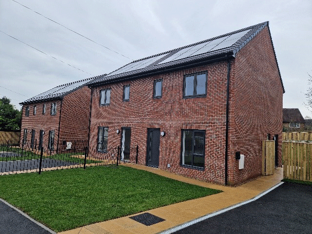 A newly built four bed house with a grass lawn
