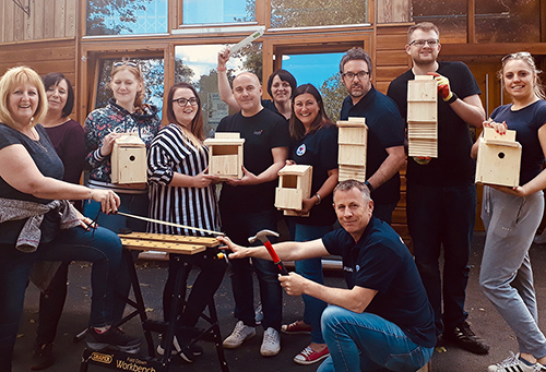 Volunteers making bird boxes