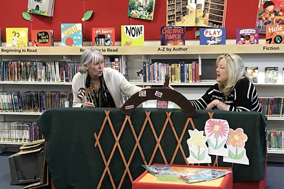 two women telling a story