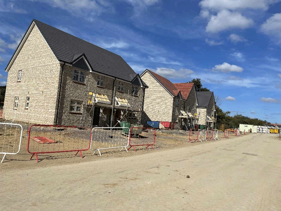 A new home development in the late stages of being built.