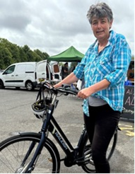 Lady on a bicycle.