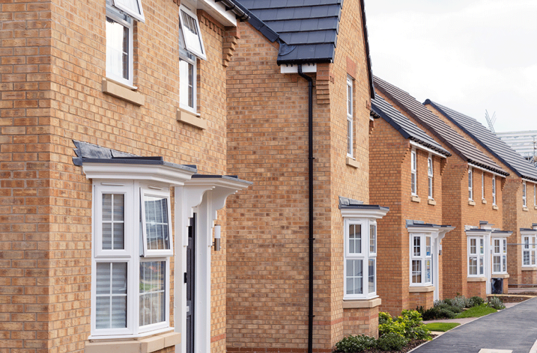 block of semi detached red bricked houses