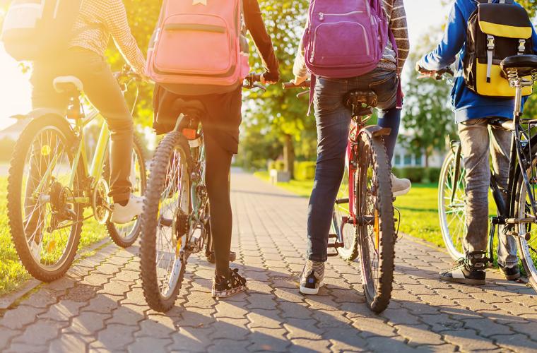 children riding bikes to school