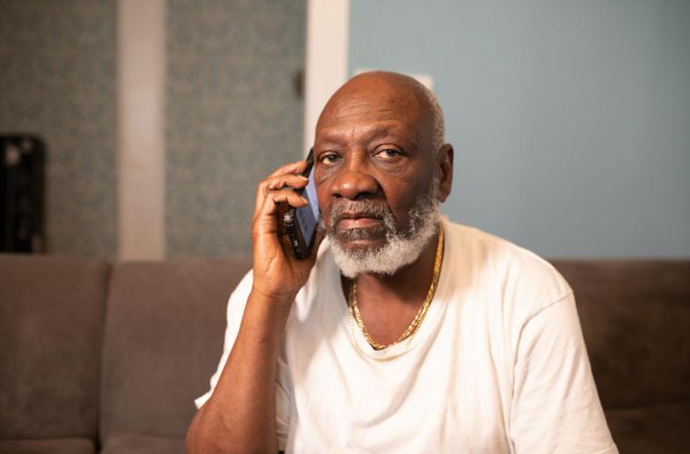 Elderly man using a mobile phone