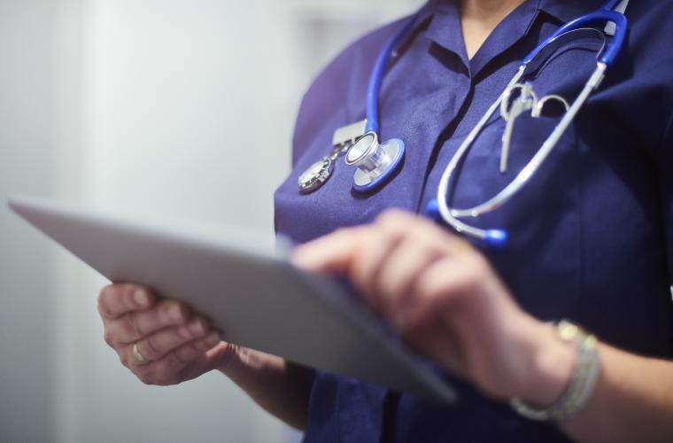 Nurse with stethoscope and clipboard