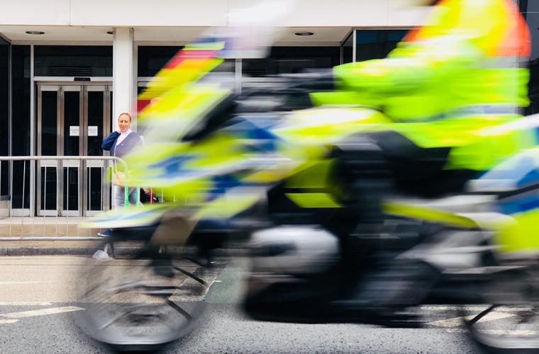 Police officer driving motorbike