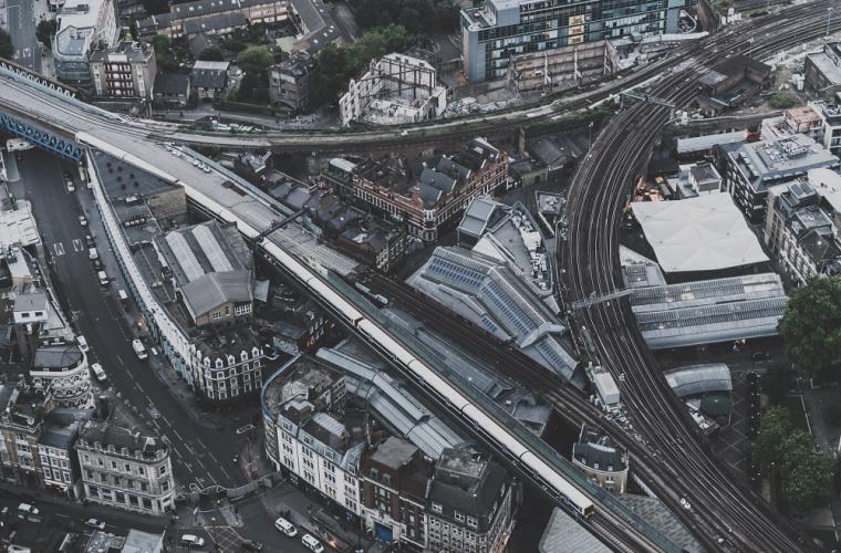 Ariel shot of trainline running through a city