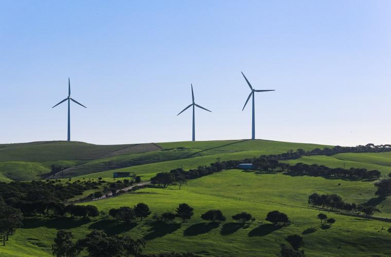 Wind turbines on a hill in the distance