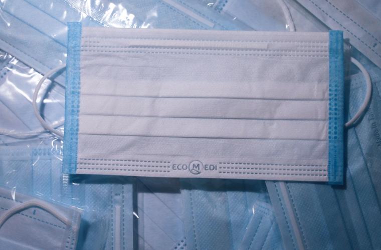 White and blue facemasks photographed from above