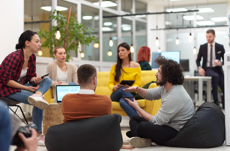 Workforce young people collaborating around a table