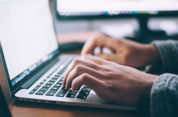 Person typing on a laptop