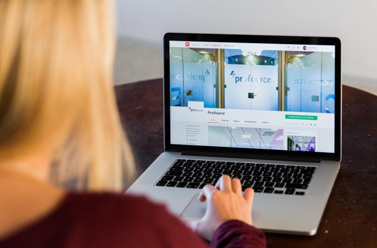 A woman on a laptop searching for a job