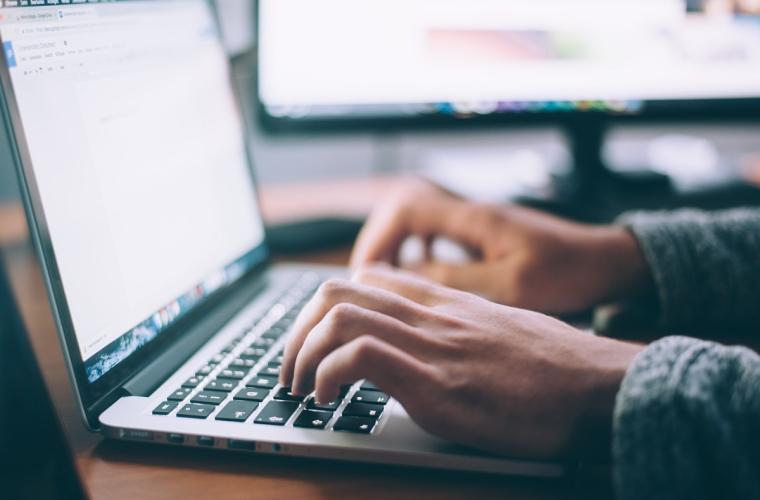 A person surfing the internet on a laptop