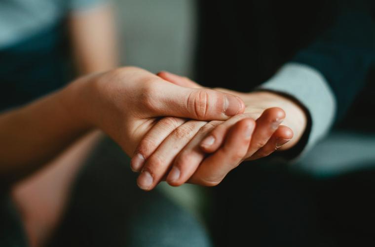 A person giving someone a helping hand