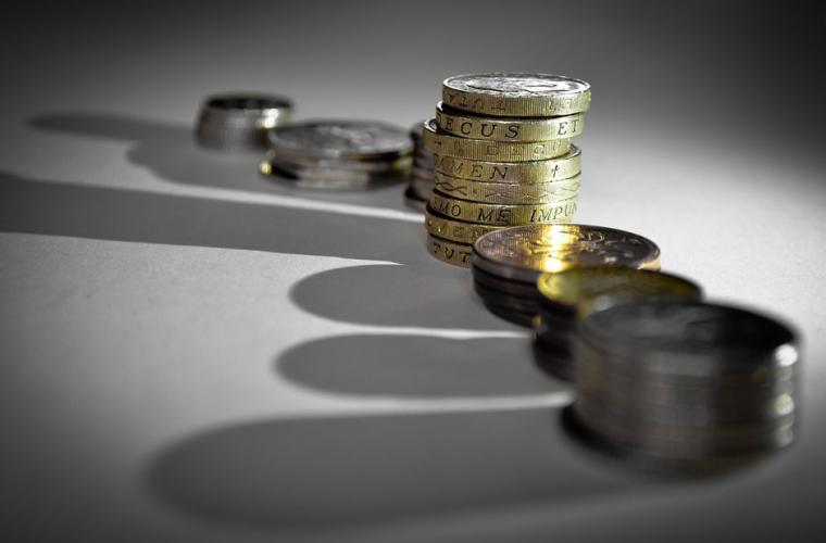 line of coins with shadows
