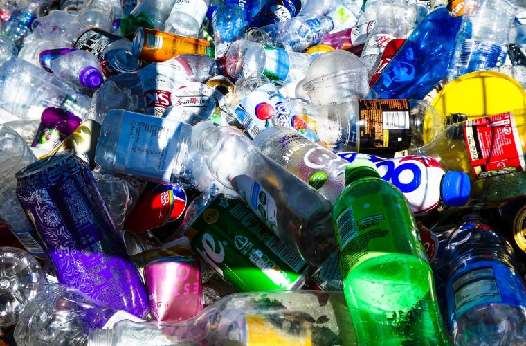 Bottles and cans in a pile waiting to be recycled