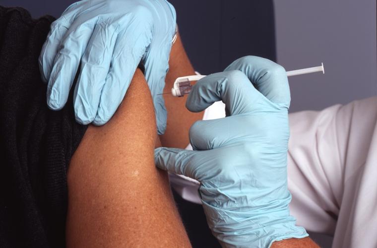 nurse administers a vaccine