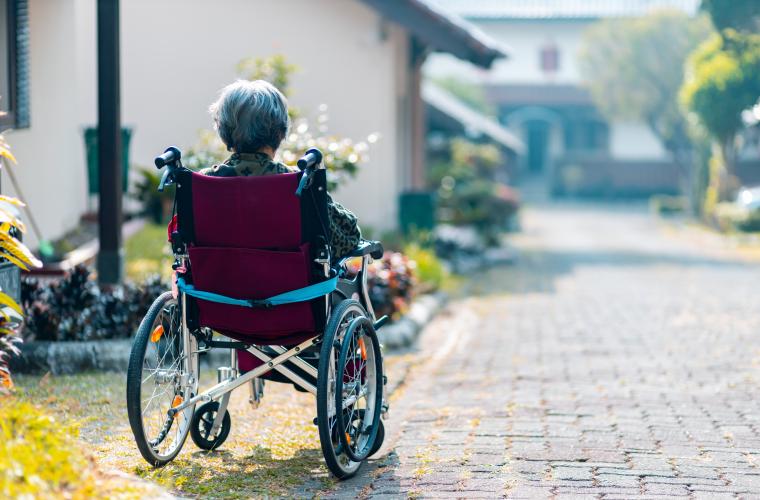 Person sitting alone in a wheelchair 
