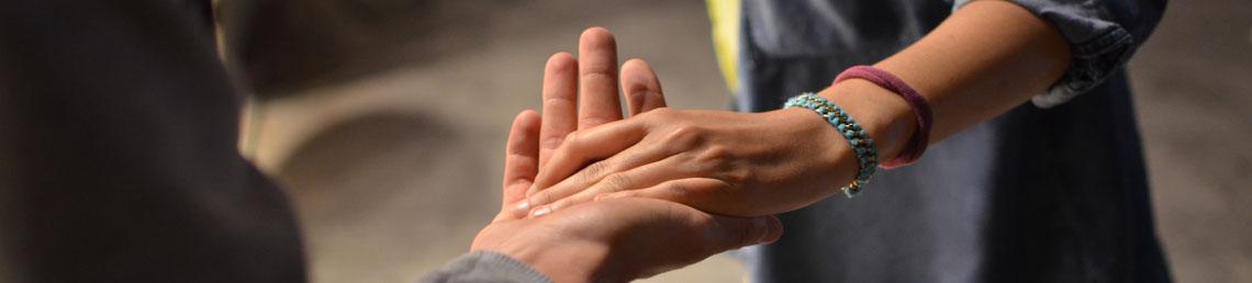 Someone giving a helping hand to another