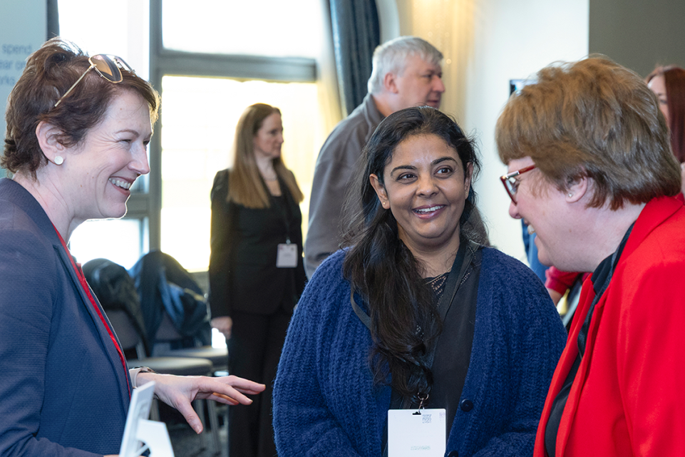Three LGA member peers in discussion during a peer network event